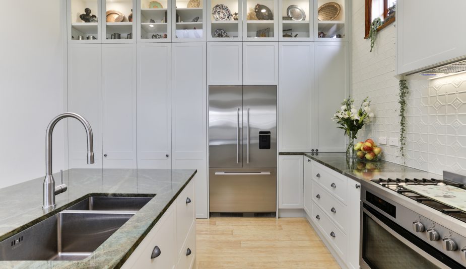 1950s home extension. Renovated Kitchen. Marble bench tops, floor to ceiling cabinetry.